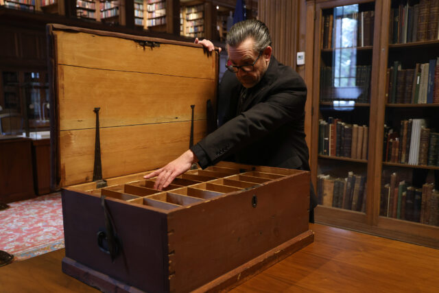 Cheney Schopieray, curator of manuscripts at the William L. Clements Library, with one of Thomas Gage’s secretarial trunks.