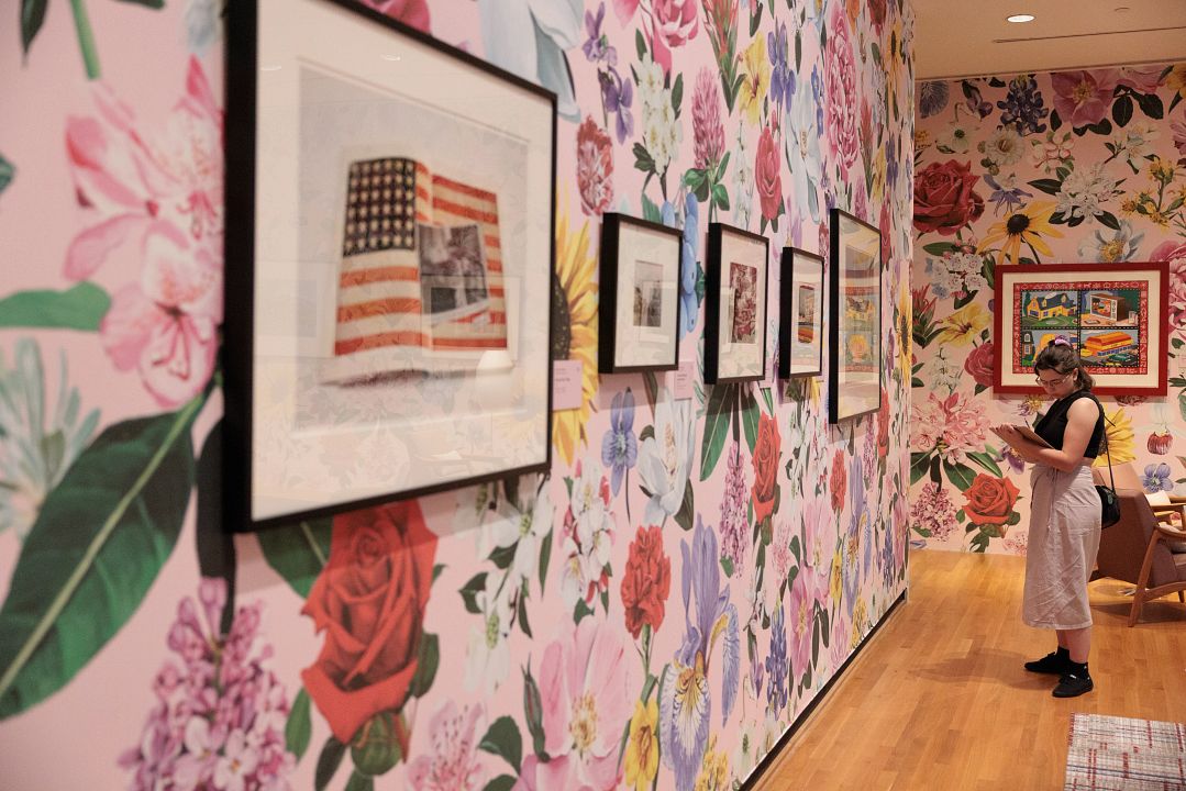 An artscapade attendee studies an exhibition.