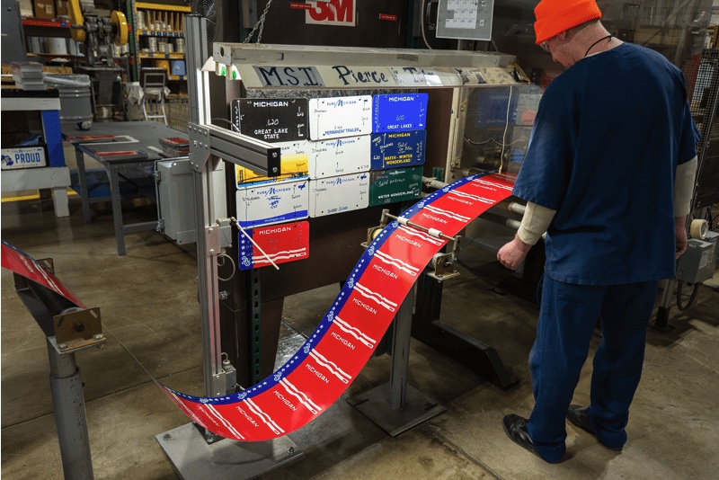 Roll of plates being imprinted before being cut