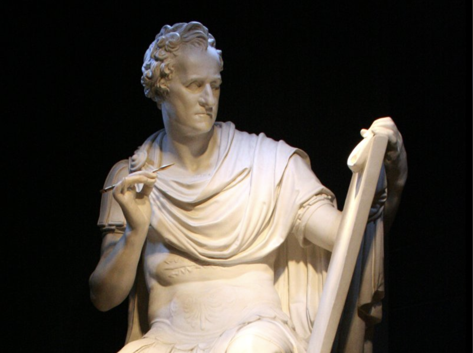 Plaster replica of Antonio Canova’s earlier marble sculpture of George Washington, who is dressed in Roman military armor as Cincinnatus, holding a tablet and quill.